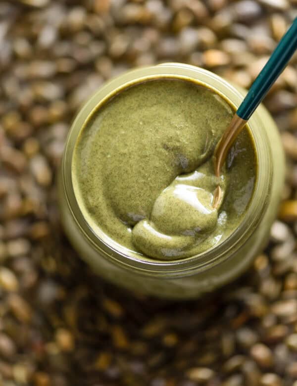 Homemade Pumpkin Seed Butter in a jar with a spoon
