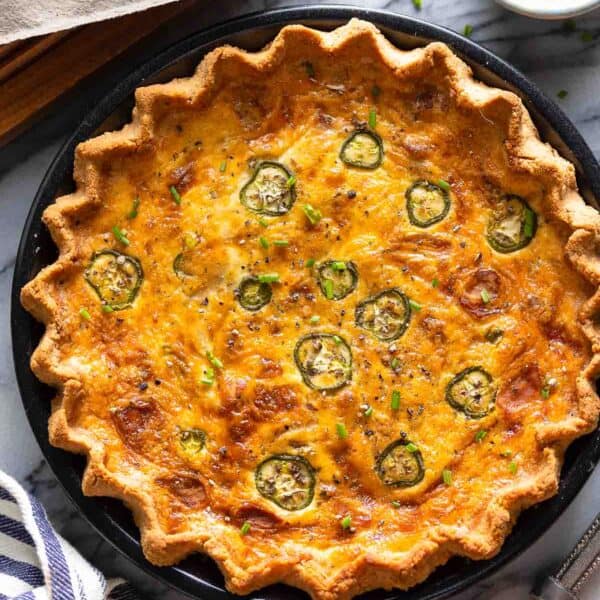 Bacon & Cheddar Jalapeño Quiche with fresh chives on top