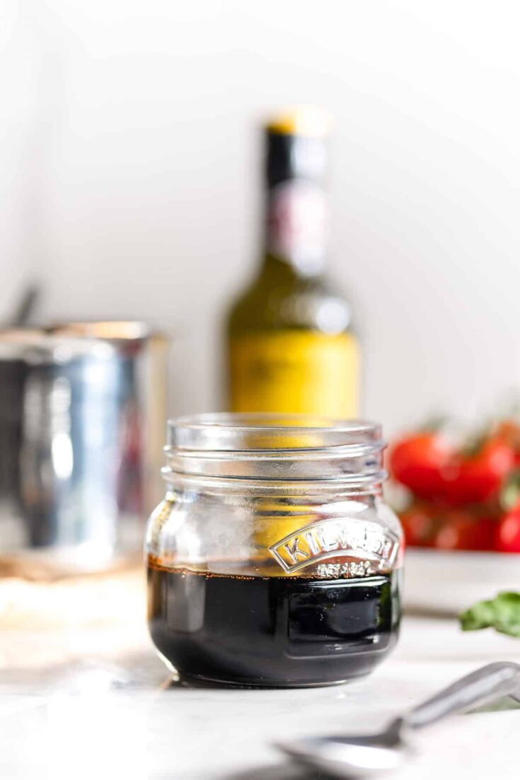 Homemade balsamic glaze in a small storage jar