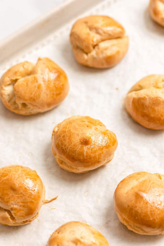 gluten free choux buns on a baking sheet