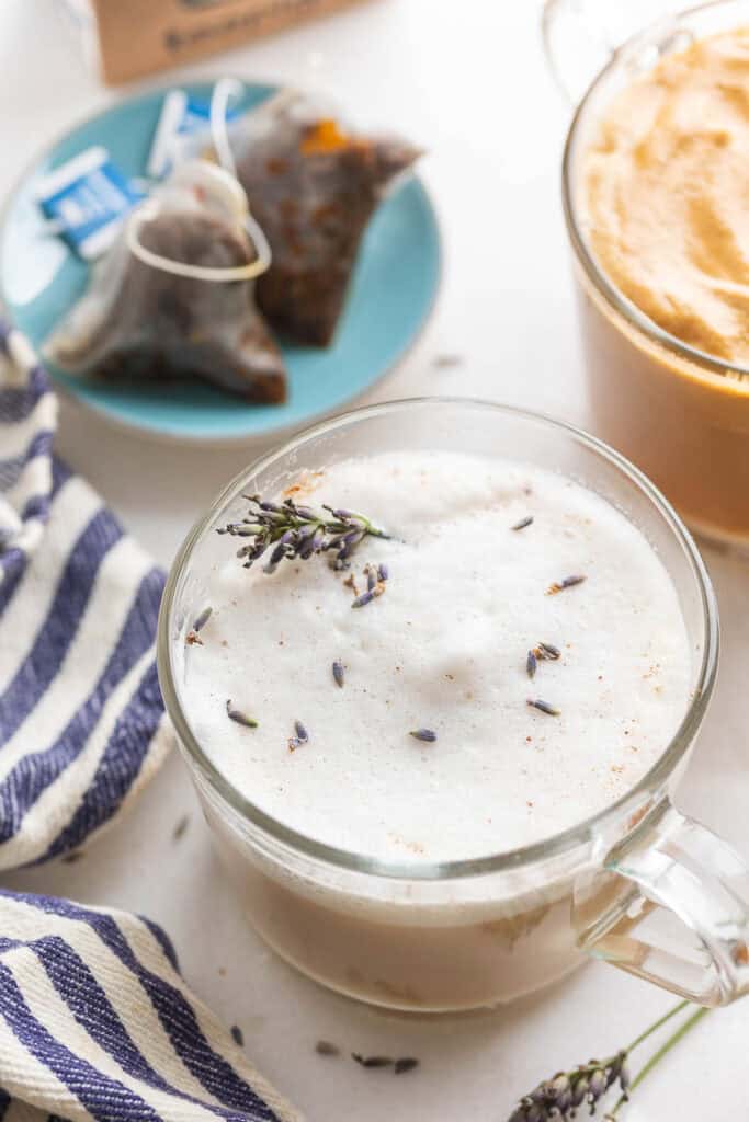 a mug of an earl grey latte (london fog) with a sprig of lavender on top