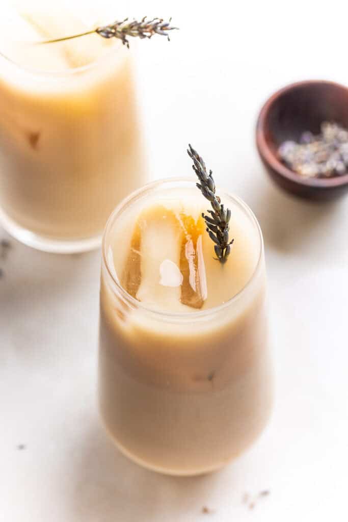 an iced London Fog latte with a sprig of fresh lavender